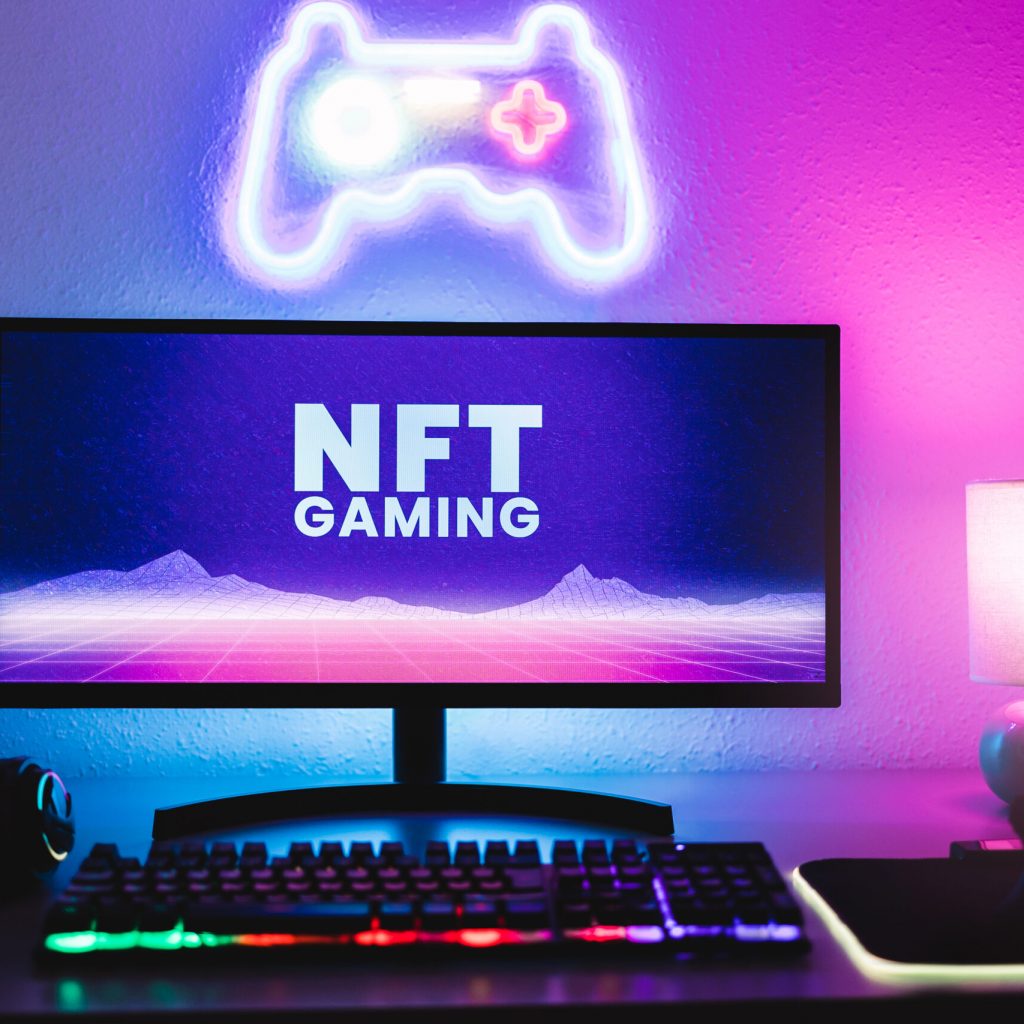 Metaverse and Blockchain Technology Concept - Gaming room displaying NFT marketplace on computer screen - Focus on monitor